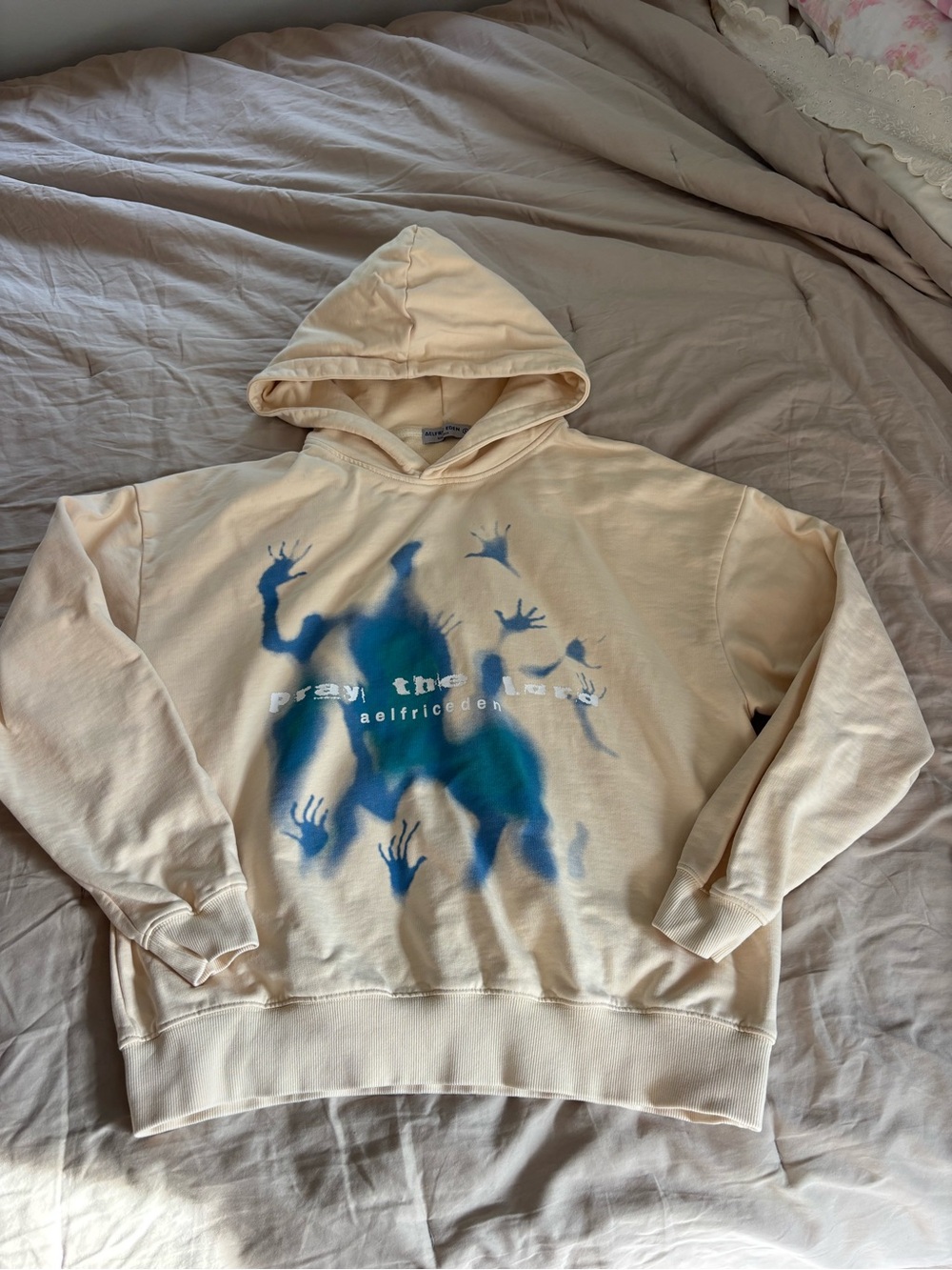 Aelfric Eden Cream Hoodie with Blue Graphic Handprint Design